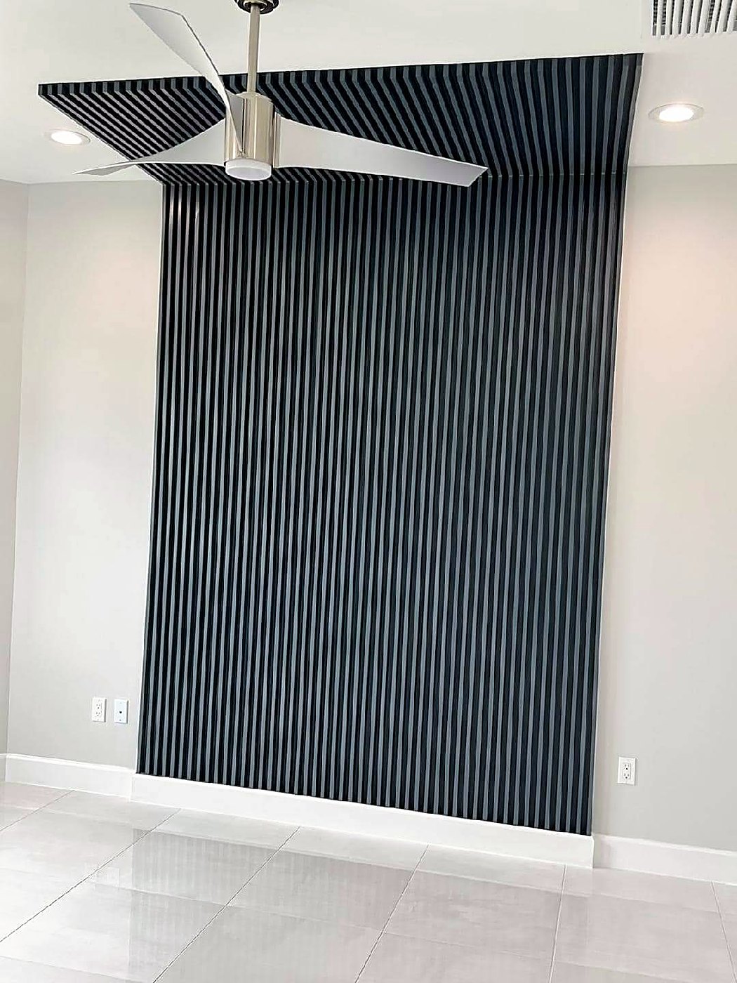 Navy slat feature wall wrapping onto the ceiling